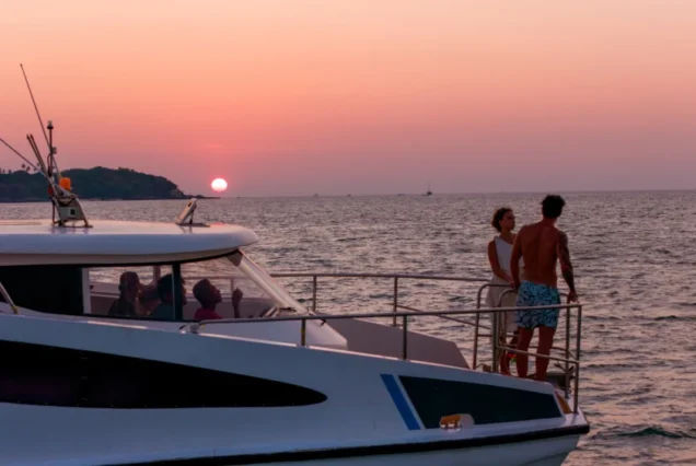Guests on the Taurus bow with a warm evening sky