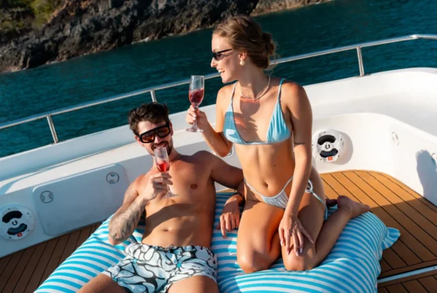 Guests relaxing on a large cushion on the Taurus upper deck