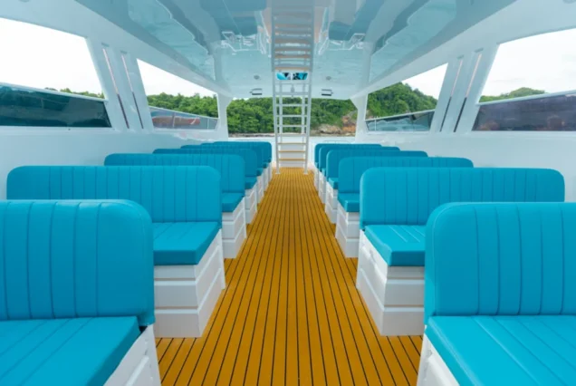 Blue upholstered seating aboard Tip-Top Catamaran
