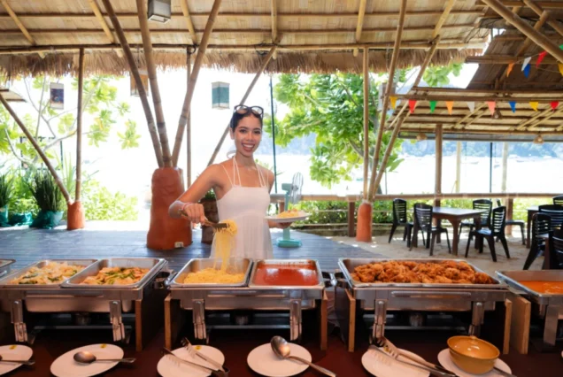 Guest selecting buffet food on the Tip-Top trip